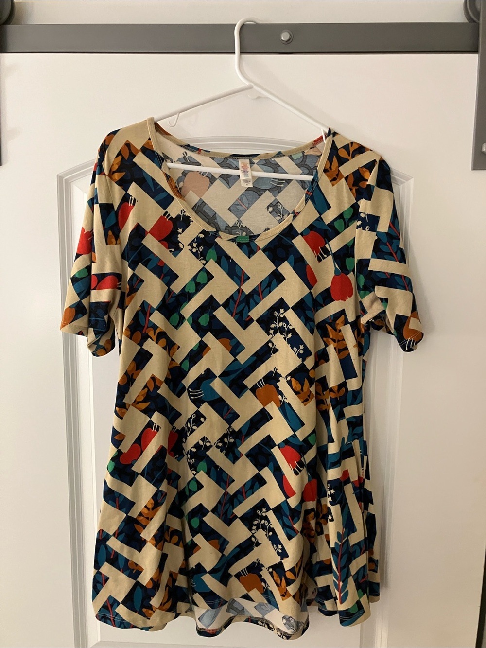LuLaRoe Cream Tunic with Navy, Teal, Red & Mustard Geometric Floral Print
